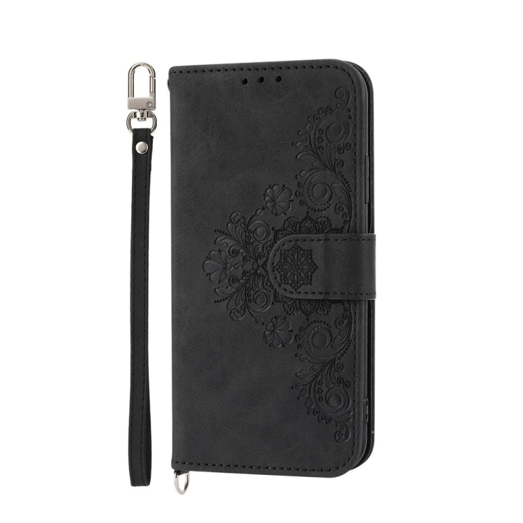 For iPhone 16e Skin-feel Flowers Embossed Wallet Leather Phone Case(Black) - iPhone 16e Cases by PMC TechLife | Online Shopping South Africa | PMC TechLife | Buy Now Pay Later Mobicred